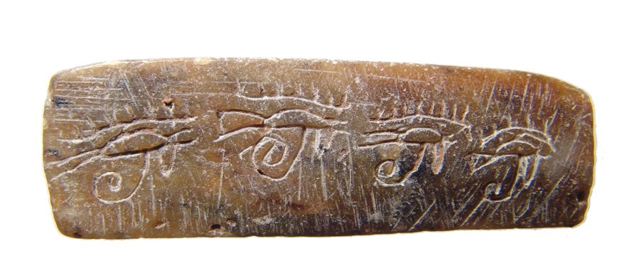 An interesting Egyptian steatite amulet: An interesting Egyptian steatite amulet, Graeco-Roman, c. 2nd Century BC - 2nd Century AD, one side with 4 incised Eyes of Horus, the other side with a pair of Djed pillars of Osiris. L: 1 7/8 in (4.8