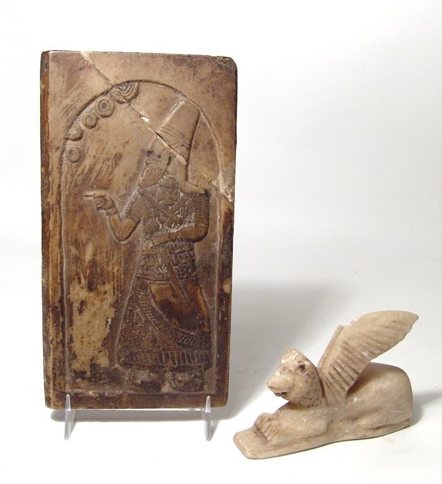 Assyrian-style stone relief and a winged lion: An Assyrian-style stone relief and a winged lion, 20th Century. The first piece is an Assyrian-style limestone relief, 8 1/8 in x 4 1/4 in, (18 x 11 cm), the second is a calcite winged lion, end of on