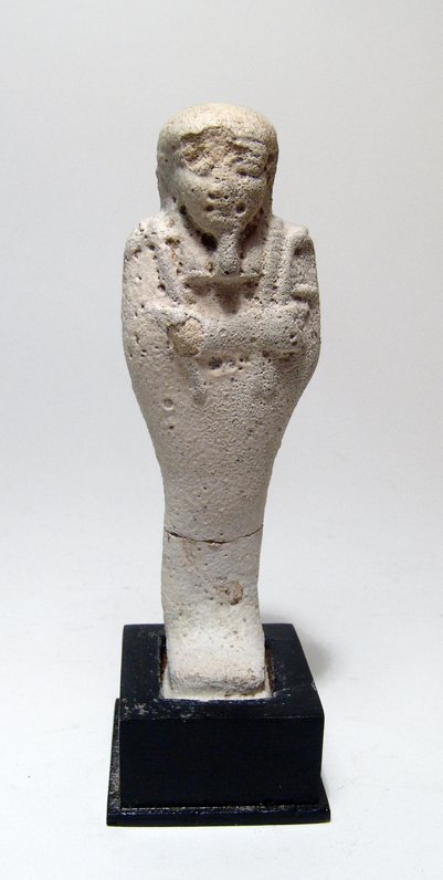 Egyptian pale blue faience ushabti, Late Period: An Egyptian pale blue faience ushabti, Late Period, c. 664 - 30 BC, mummiform, wearing tripartite wig and false beard, arms folded across chest, hands holding a pick and hoe, bag over left shoulder, v