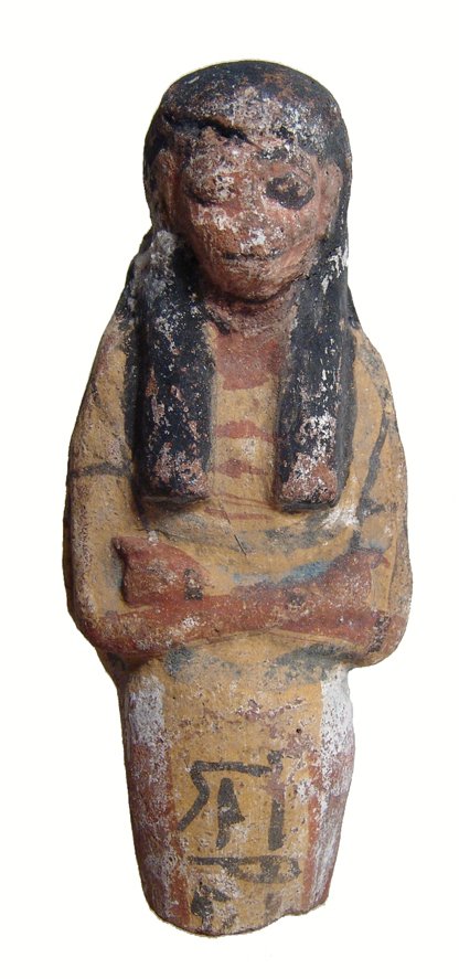 An Egyptian polychrome terracotta ushabti: An Egyptian polychrome terracotta ushabti, later New Kingdom, c. 1200 – 1075 BC, mummiform, wearing tripartite wig and broad collar, arms folded across chest, hands clutching hoes and a vertical col