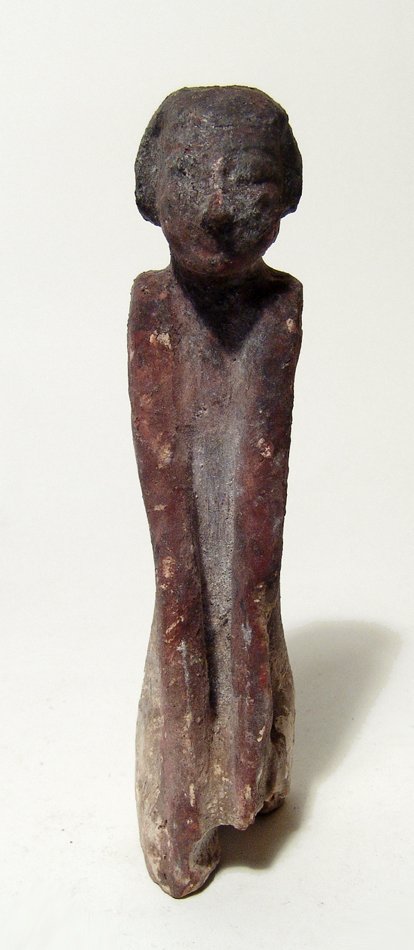 An Egyptian wooden figure, Middle Kingdom (1 of 4)