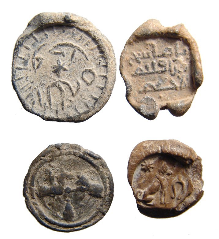 A lot of 3 leads seals or tokens from the Holy Land: A lot of 3 leads seals or tokens from the Holy Land. Lot includes a terracotta token depicting the Sothic dog, Egypt, c. 1st - 3rd Century AD, star Sirius above, amulet before, (1.8 x 2 cm), a Roman l