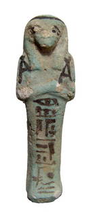 Egyptian faience bicolor faience Ushabti: An Egyptian faience bicolor faience Ushabti, 3rd Intermediate Period, 22nd Dynasty, c. 945 - 715 BC, mummiform, short wig with seshed head band, arms folded at chest, hands holding hoes, basket at