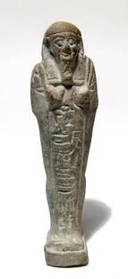 Egyptian faience ushabti, Late Period: An Egyptian faience ushabti, Late Period, c. 664 - 30 BC, mummiform, wearing tripartite wig and false beard, arms folded across chest, hands holding a pick and hoe, bag over left shoulder, vertical co