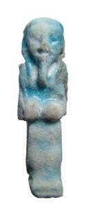 Egyptian light blue faience ushabti: A small Egyptian light blue faience ushabti, Late Period, c. 664 - 30 BC, frontally molded with interesting style. H: 2 in (5cm). Ex Wiltshire, UK private collection.