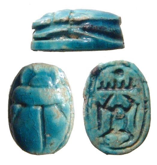 An Egyptian steatite scarab, Late Period: An Egyptian steatite scarab, Late Period, c. 664 – 332 BC, the body nicely carved with the praenomen of Thurmose III, ‘Men-Kheper-Re’ on the base in amuletic fashion. L: 1.1cm. Reglazed. Ex coll