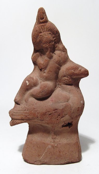 Egyptian statuette depicting Harpokrates astride goose: An Egyptian terracotta statuette depicting Harpokrates astride a goose, Ptolemaic, c. 1st Century BC, the youthful god is nude and wears a large bound wreath surmounted by a double crown, hid right fi