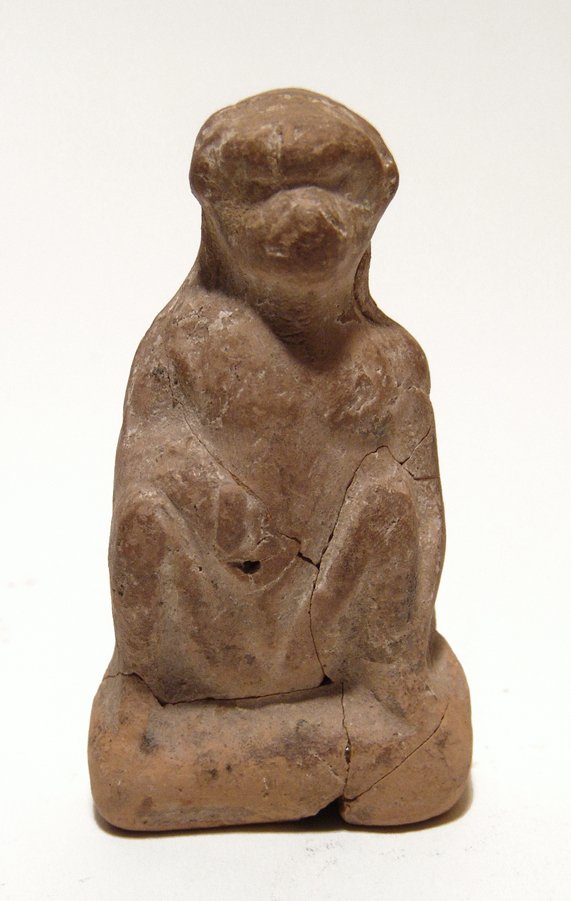 Egyptian terracotta figurine of Thoth in baboon form: An Egyptian terracotta figurine of Thoth in baboon form, Ptolemaic Period, c. 332 - 30 BC, sitting on its haunches, right hand on its belly. H: 3 in (7.7cm). Light deposits. Ex Upstate New York privat