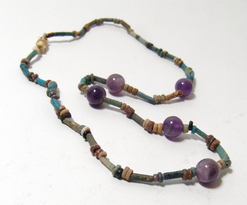 A necklace with Egyptian faience and amethyst beads: A necklace with Egyptian faience and amethyst beads. The faience beads, Late Period, c. 664 - 30 BC, with nice color and of the disk and tubular variety strung with modern circular amethyst beads. Len