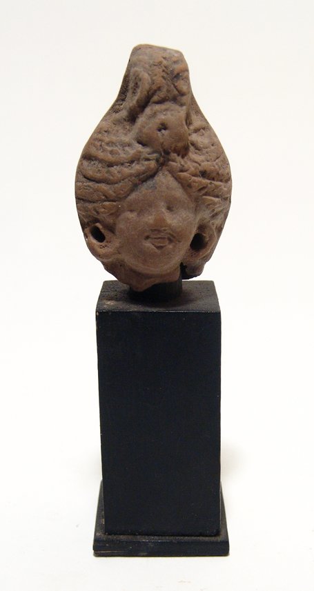 A Greek terracotta head of a woman (1 of 3)