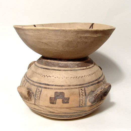 A large Daunian buff olla, or funeral krater, Italic: A large Daunian buff olla, or funeral krater, Italic, c. 5th - 4th Century, with brown geometric design in four registers surrounded by line decoration and pellets, H: 7 4/5 in (19.8cm), D: 8 2/3 in (