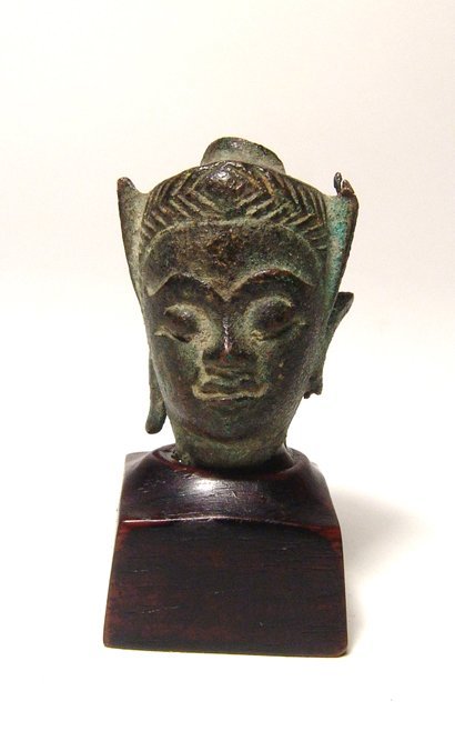 A bronze head of Buddha, Thailand (1 of 4)