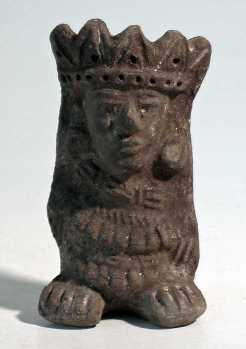 An excellent Zapotec figure from Mexico: An excellent Zapotec figure from Mexico, ca. 100 - 500 AD. It is 4-1/4 in high and depicts an individual wearing a fancy headdress, large ear ornaments and extensive ceremonial regalia. Beautifully de