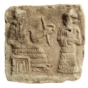 A beautiful Old Babylonian terracotta votive plaque: A beautiful Old Babylonian terracotta votive plaque, c. 1900 - 1750 BC, depicting a seated god extending a measuring rod and cord to a another god standing before him. Both wear long flounced gowns,