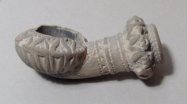 A detailed Levantine antique ceramic smoking pipe (1 of 2)