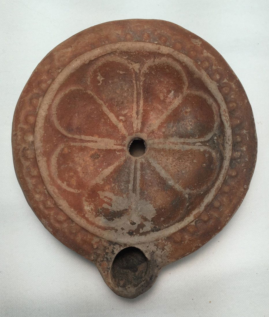 A lovely red-orange Roman discus lamp with rosette (1 of 2)