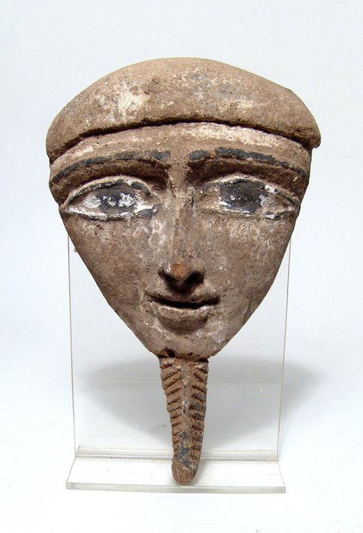 An Egyptian wood 'Mummy' mask, Late Period (1 of 2)