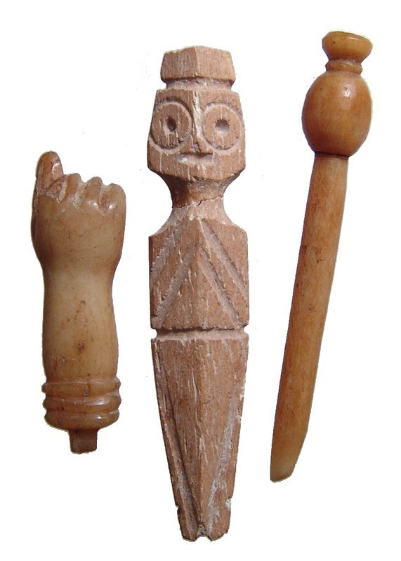 A lot of 3 bone objects from Roman Egypt: A lot of 3 bone objects from Roman Egypt. Lot includes an amulet of a clenched fist, c. 1st - 3rd Century, signifying vigorous action, (L: 3.4 cm), a small applique in the form stylized person, c. 3rd