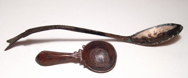 A pair of antique spoons, bronze and silver. (1 of 9)