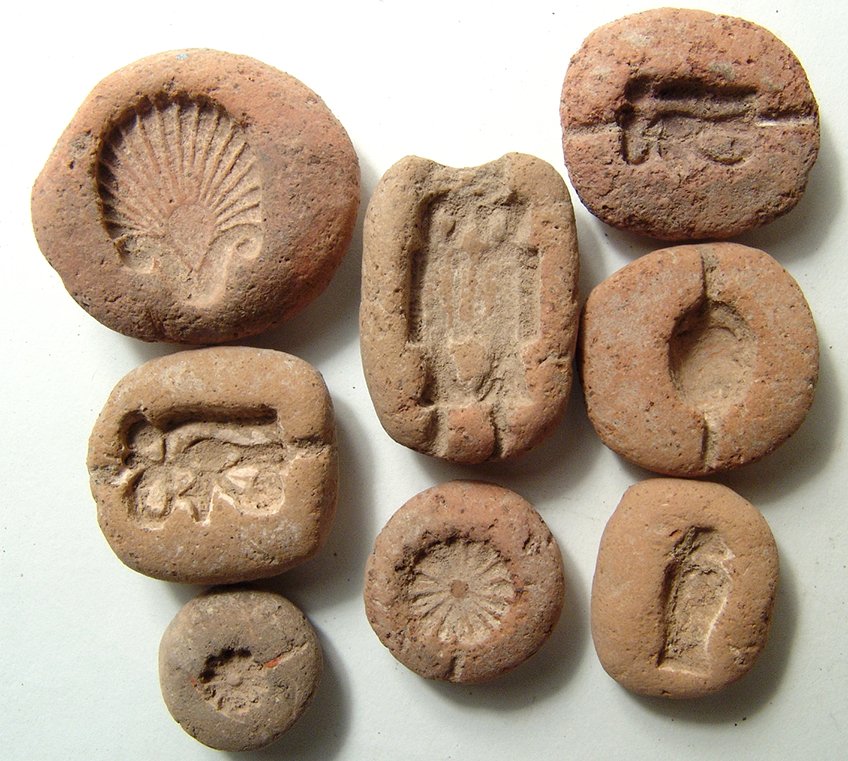 A lot of 8 Egyptian terracotta amulet molds: A lot of 8 Egyptian terracotta amulet molds, New Kingdom, c. 1570 - 1075 BC. Lot includes a pair of mold for a Wedjat, or 'Eye of Horus', one of which with a uraeus before it, a lovely molded for a pa