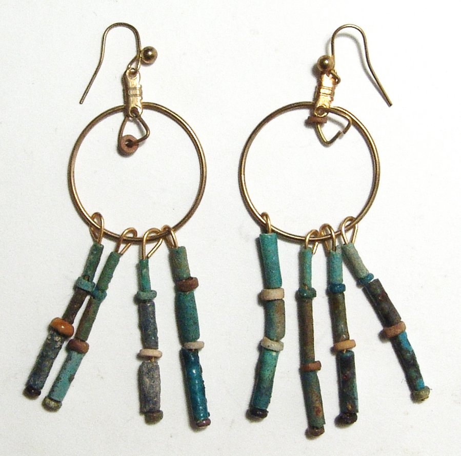 A pair of Egyptian faience bead earrings: A pair of Egyptian faience bead earrings. The multicolor faience beads date from the Late Period, c. 664 - 30 BC, and they have strung onto earrings in precise ancient style with brass fittings and ea