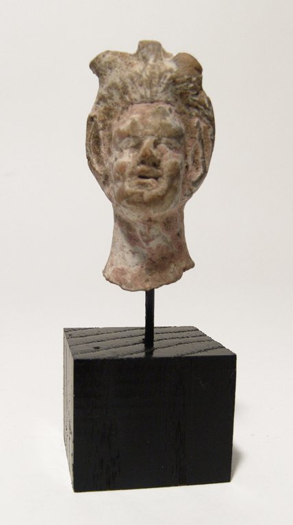 A Greek terracotta head of a satyr (1 of 4)