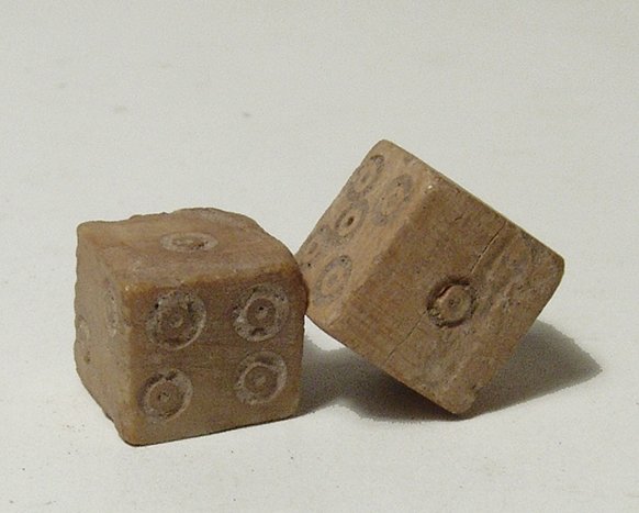 A pair of Roman bone dice: A pair of Roman bone dice, c. 1st – 4th Century AD, numbered with dots one through six per the standard style. Both nicely preserved and a great example of an item from everyday life. Faces measure 