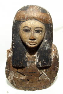 Fantastic upper portion from an Egyptian wood coffin: A fantastic upper portion from an Egyptian wood coffin lid or cover board, Ramesside Period, c. 1293 – 1185 BC, the face in nice style with long black wig, head band centered with a lotus flower and