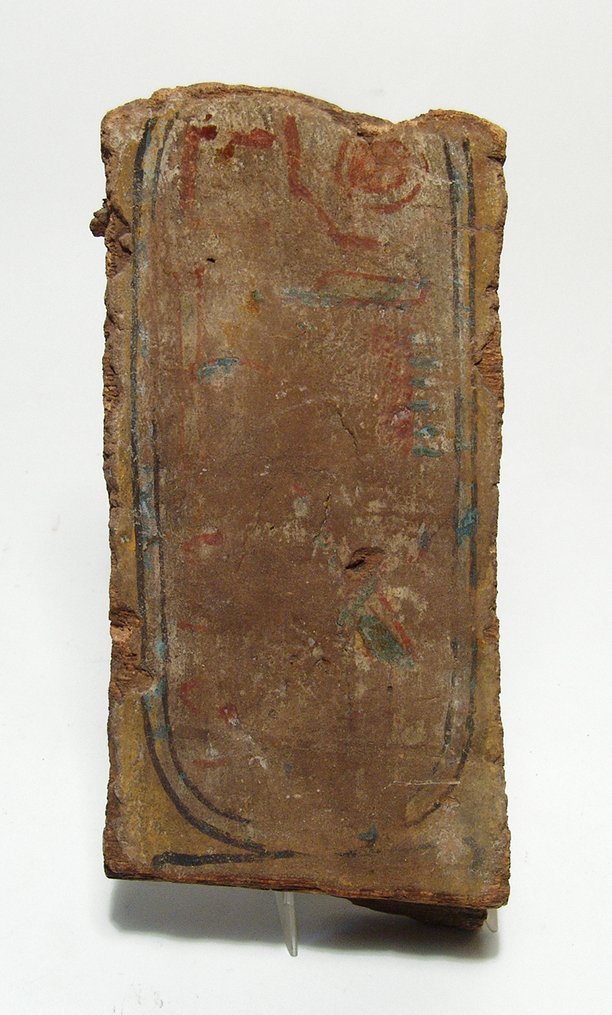 Egyptian wood panel with painted cartouche: An Egyptian wood panel with painted cartouche, c. 1200 - 332 BC, with several partial hieroglyphic characters visible in red, blue, green, black and white. The back side also with remnants of gesso an