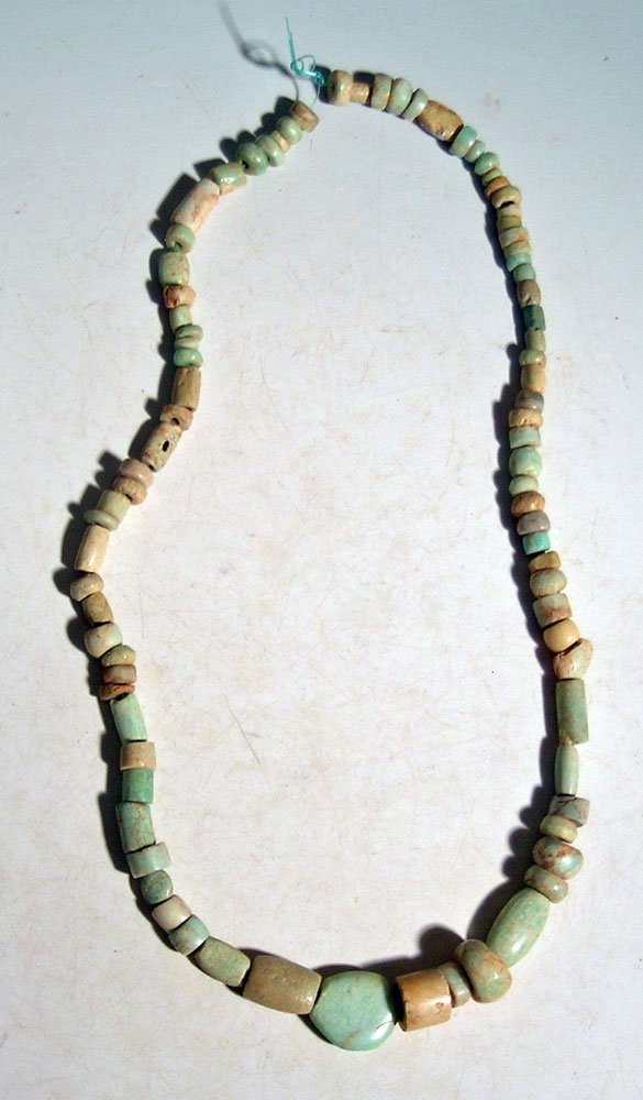 A lovely turquoise necklace from Ecuador: A lovely turquoise necklace from Ecuador, ca. AD 1000 - 1500. It is 20-1/2 in long and is comprised of beads of varied sizes and types, with a small center pendant. Ex New World Artifacts Gallery.