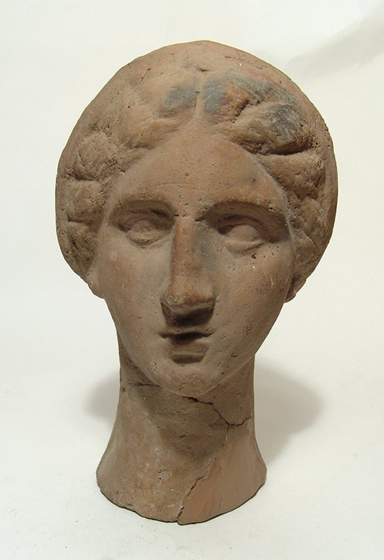 A very attractive Etruscan terracotta head of a woman (1 of 5)