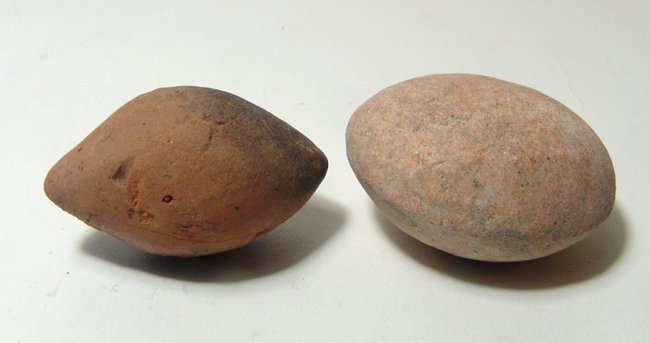 A pair of ancient clay sling bullets (1 of 2)