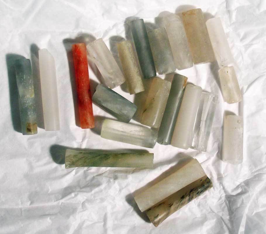 A bag of excellent Calima crystal beads: A bag of excellent Calima crystal beads from Colombia, ca. 300 BC - 300 AD. They are up to 2 in long and include two rare types with flared ends. Beautifully polished tubes. Ex New World Artifacts Gal