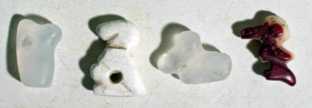 A group of four avian form Tairona pendants (1 of 2)