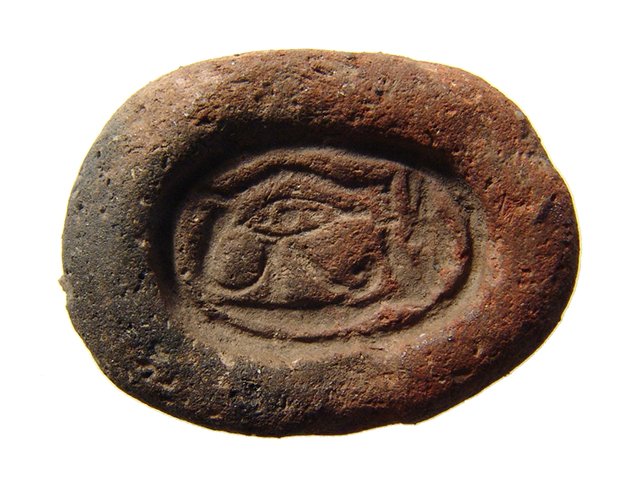 An Egyptian faience Eye of Horus amulet mold: An Egyptian faience Eye of Horus amulet mold, Late New Kingdom – 3rd Intermediate Period, c. 1200 – 664 BC, well-preserved with great detail and light deposits. L: 1 ¼ in (3.2cm). Ex collection o