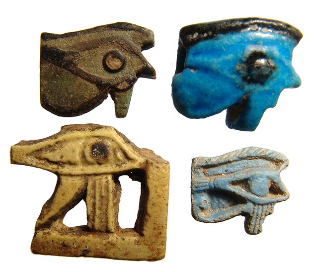 Lot of 4 Egyptian faience Eye of Horus amulets: A lot of 4 Egyptian faience Eye of Horus amulets, 3rd Intermediate Period, c. 1075 – 664 BC, each are molded, one with very crisp detail and three are bicolor with black additions. Largest 23 x 19mm