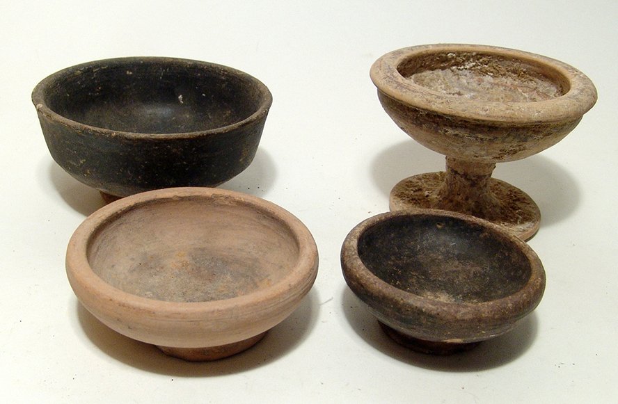A group of four ancient Greek bowls (1 of 3)