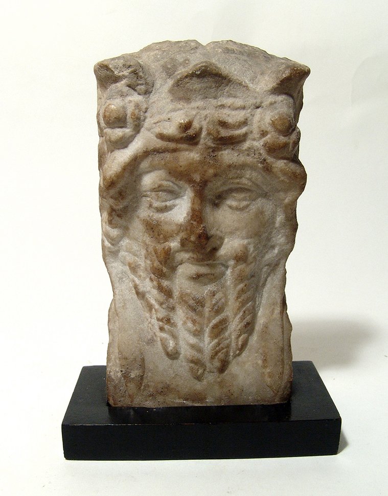 A Roman marble relief of a bearded satyr (1 of 2)