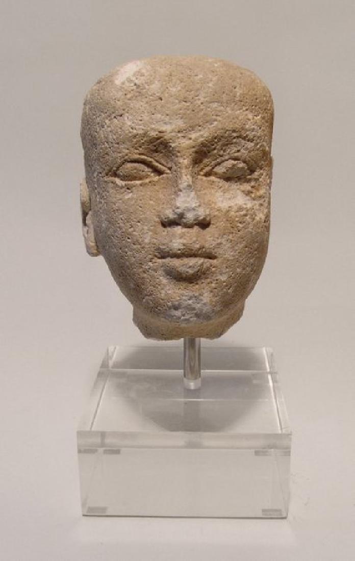 Egyptian limestone head of a male youth, Late Period (1 of 8)