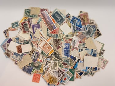 Big pile of vintage postmarked stamps