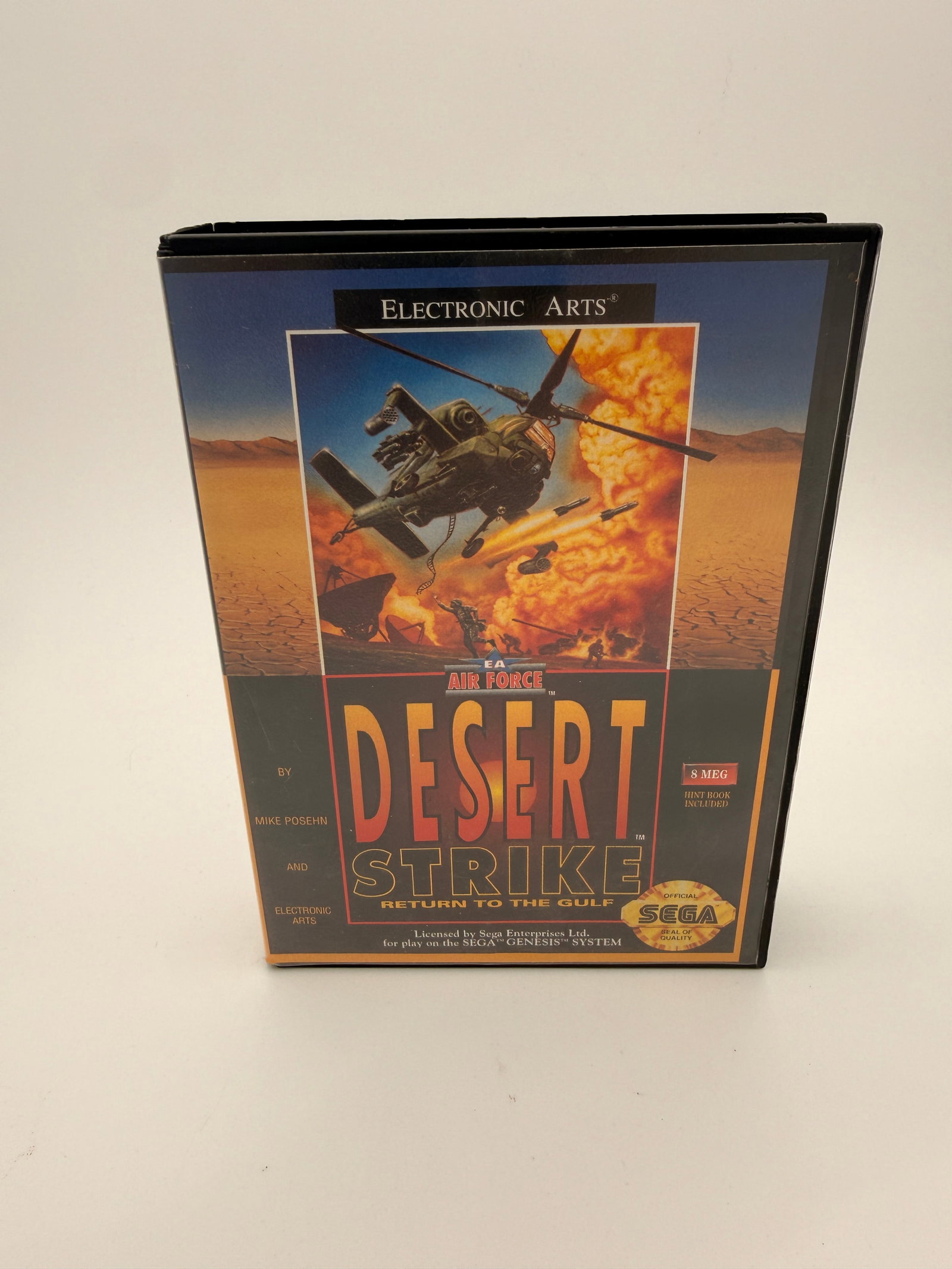 Desert Strike: Return to the Gulf – Sega Genesis, Complete in Box: Electronic Arts 1992 release for Sega Genesis, includes cartridge, manual, and inserts. Early EA hit known for its strategy-based helicopter combat gameplay.