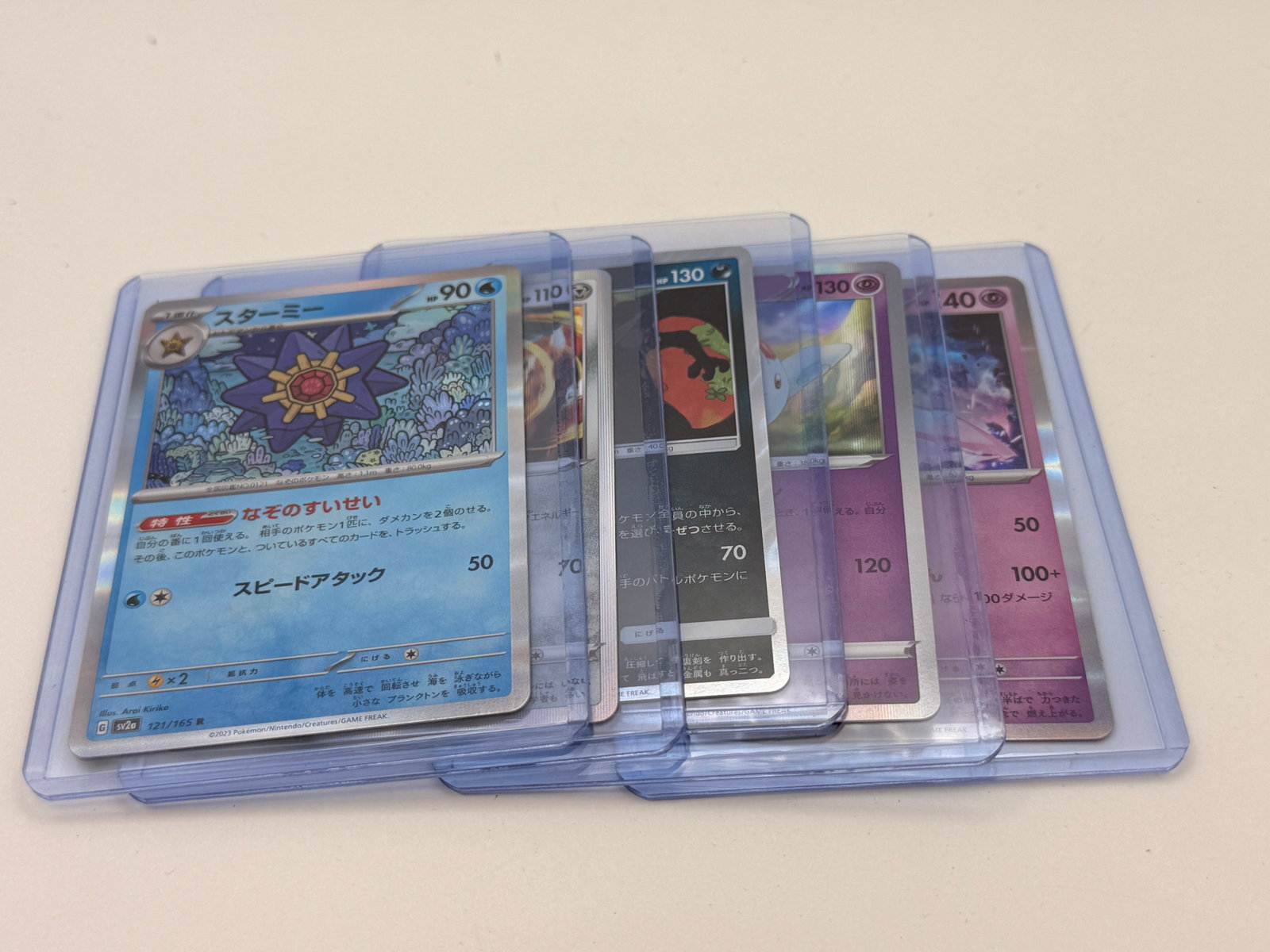 Lot of 5 Japanese Pokémon Holographic Cards: Five Japanese Pokémon holographic cards, assorted characters, sold as a random lot.