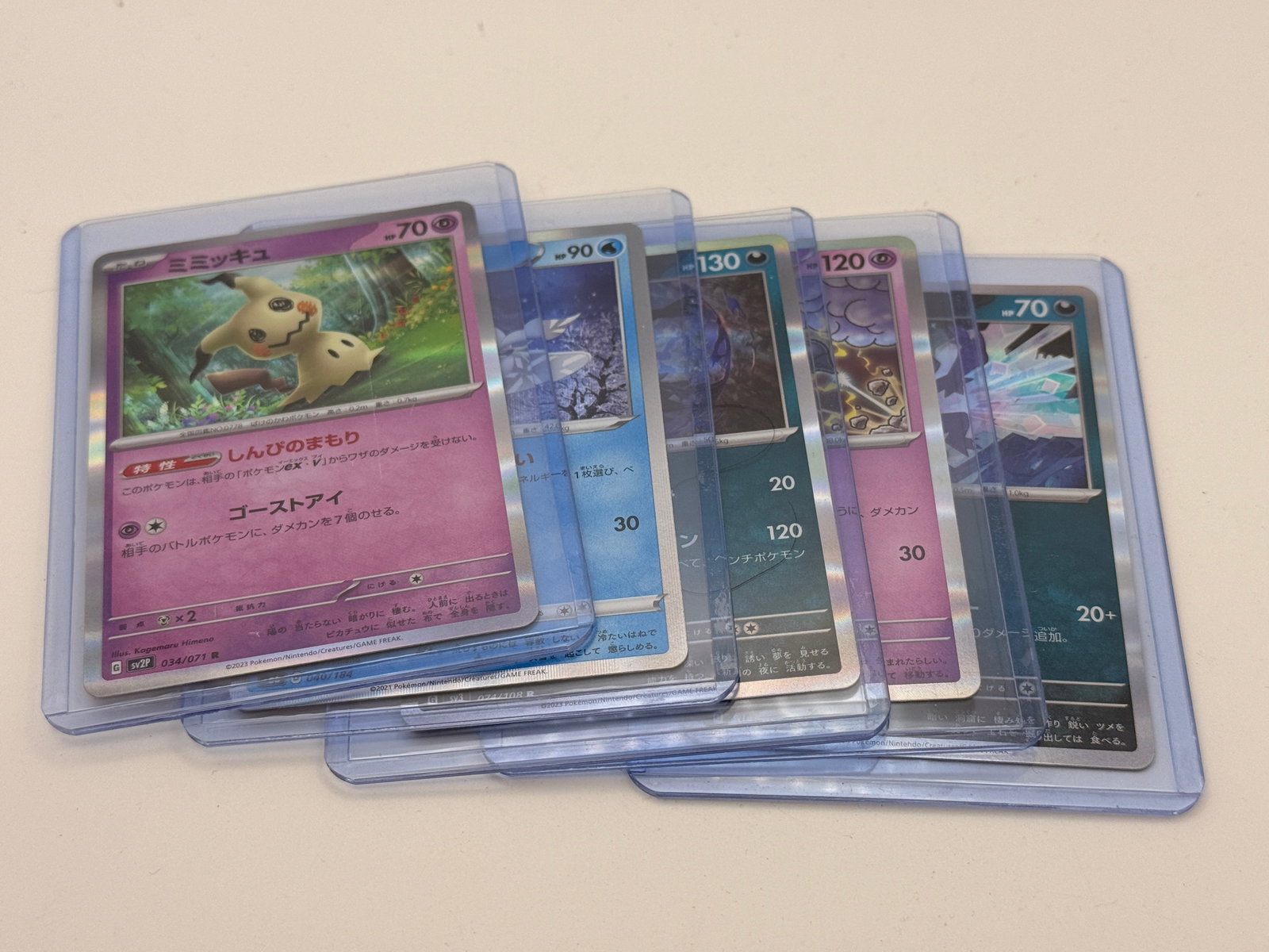 Lot of 5 Japanese Pokémon Holographic Cards: Five Japanese Pokémon holographic cards, assorted characters, sold as a random lot.