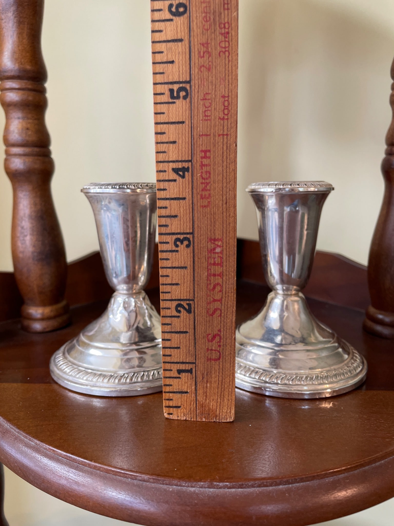 Towle Weighted Sterling Silver Candlesticks: Towle sterling silver candlesticks with a weighted base. Marked on the bottom 'Towle,' 'Sterling,' and 'Weighted and Reinforced.' The items measure approximately 3 inches in height. Traditional