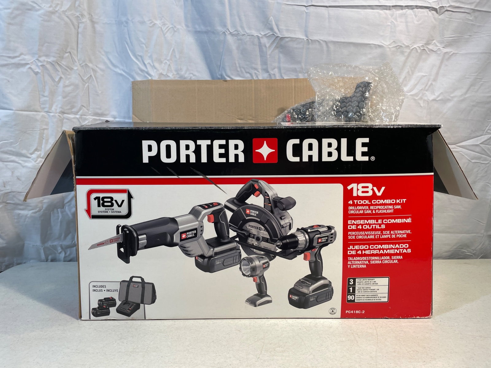 Porter Cable 18V 4-Tool Combo Kit Model PCCK405N, Sealed and Not Tested: Porter Cable 18V 4-Tool Combo Kit, model PCCK405N. Includes a circular saw, reciprocating saw, LED flashlight, drill/driver, and carrying case. Comes with 18V batteries and a charger as per packaging.