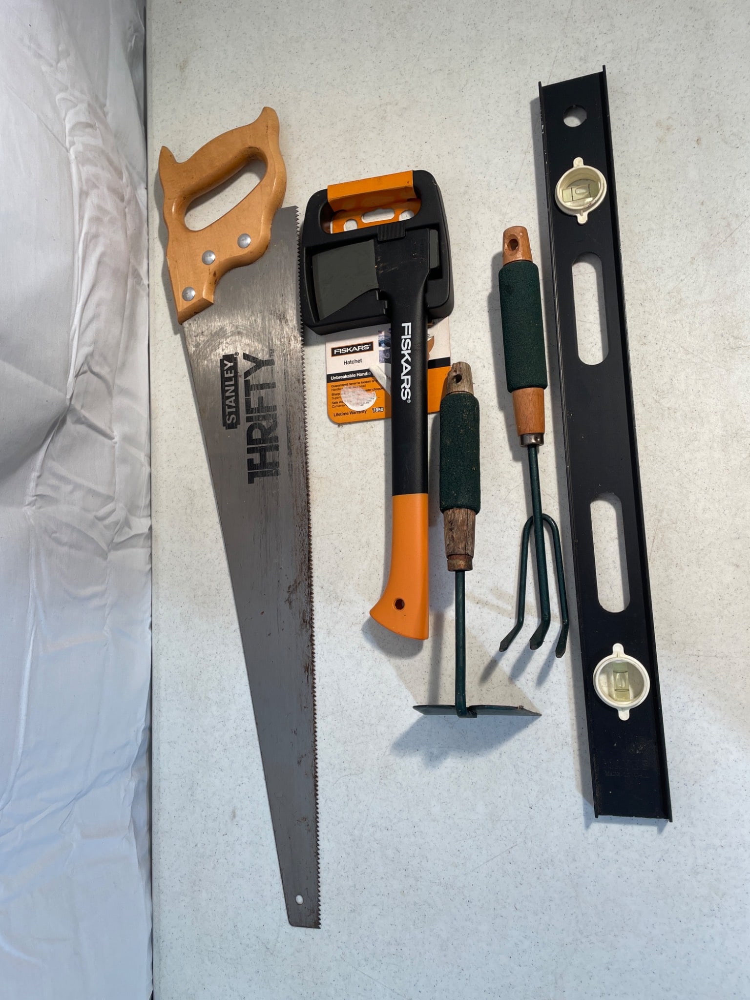 Hand Tools Including Stanley Saw, Fiskars Hatchet, Garden Tools, and a Level (1 of 2)