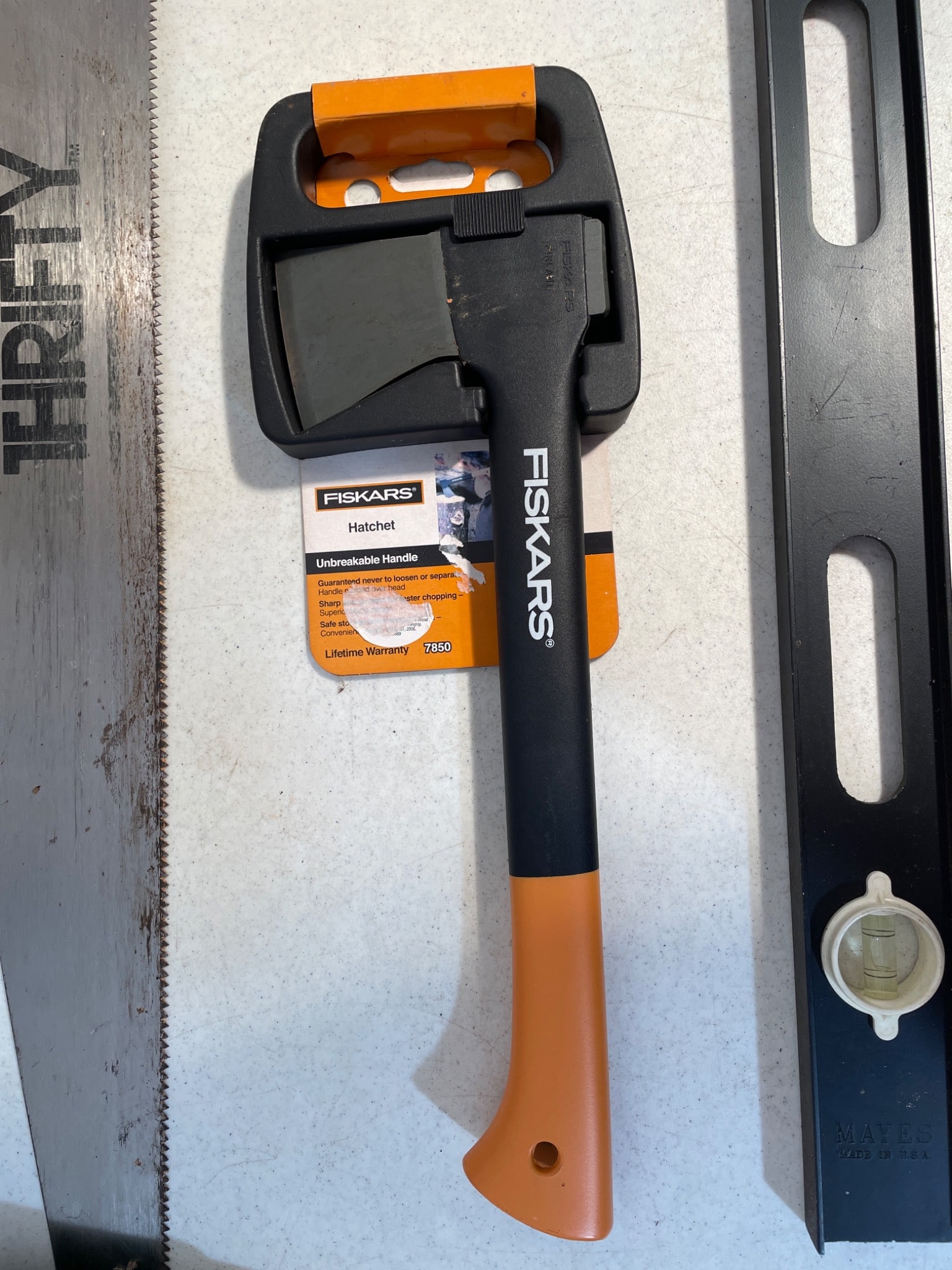 Hand Tools Including Stanley Saw, Fiskars Hatchet, Garden Tools, and a Level - 2