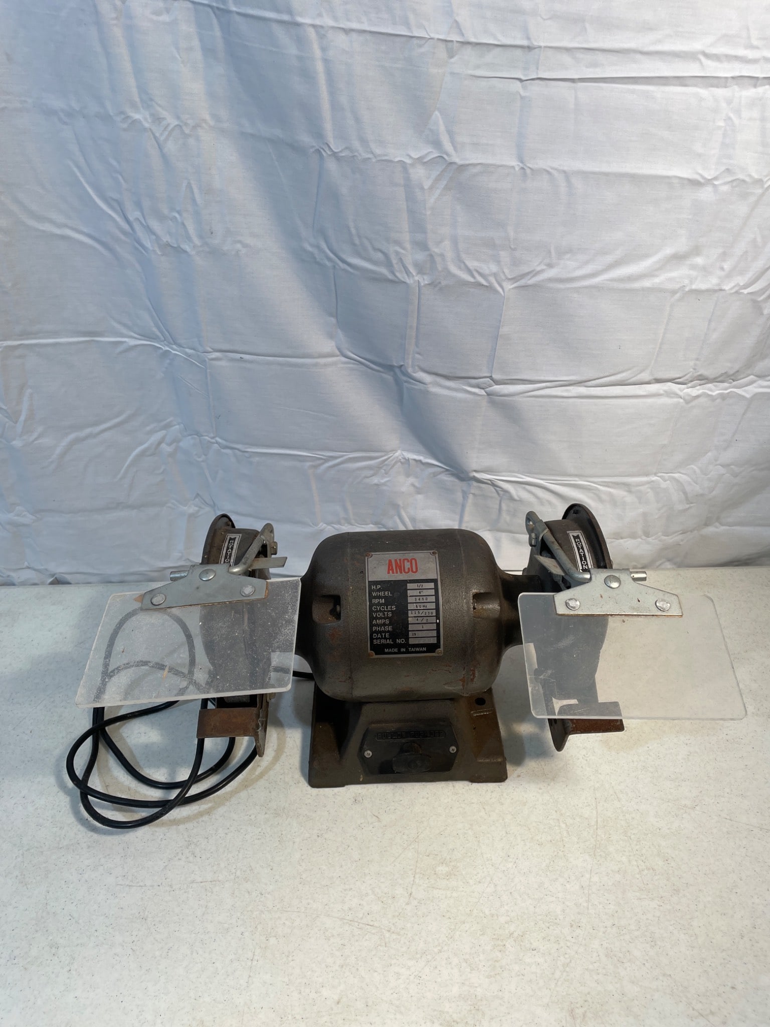 Anco 1/2 HP Bench Grinder with 6-Inch Wheel and Dual Voltage Capability: This Anco Bench Grinder features a 1/2 HP motor with 6-inch grinding wheels. It operates at 3450 RPM and offers dual voltage compatibility (115/230V) at a frequency of 60 Hz. The unit is single-phase