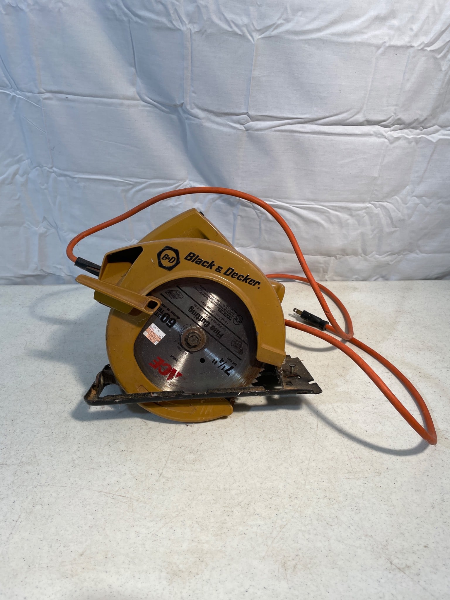 Black & Decker Circular Saw Model 7301 With Power Cord: This listing features a Black & Decker circular saw, model 7301. The unit comes equipped with its original power cord and a blade attached. The tool has been tested and is reported to be in working co