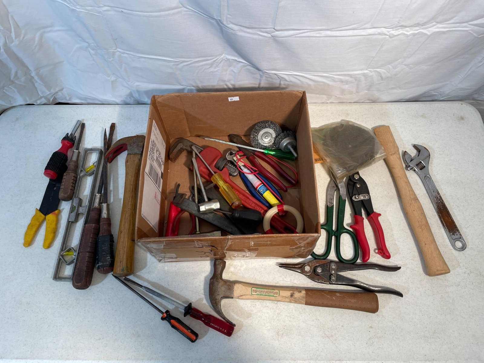 Tool Lot Including Hand Tools and Accessories: Hand tools, including a variety of hammers, screwdrivers, pliers, snips, wrenches, files, and other items. Some tools show signs of wear from use. Includes a box of additional miscellaneous small tool